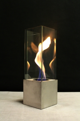 Outdoor fire feature with swirling flame